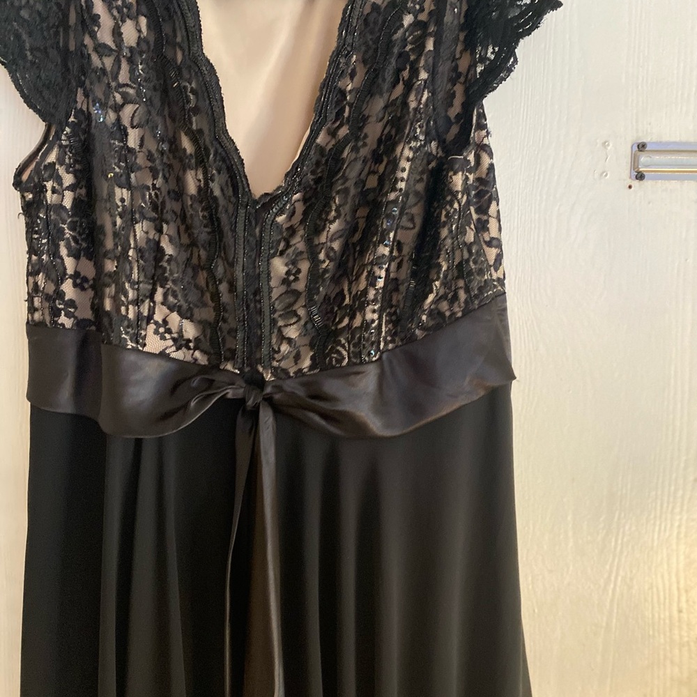 Black and tan dress with lace and sequins and hood for a party or night on town.